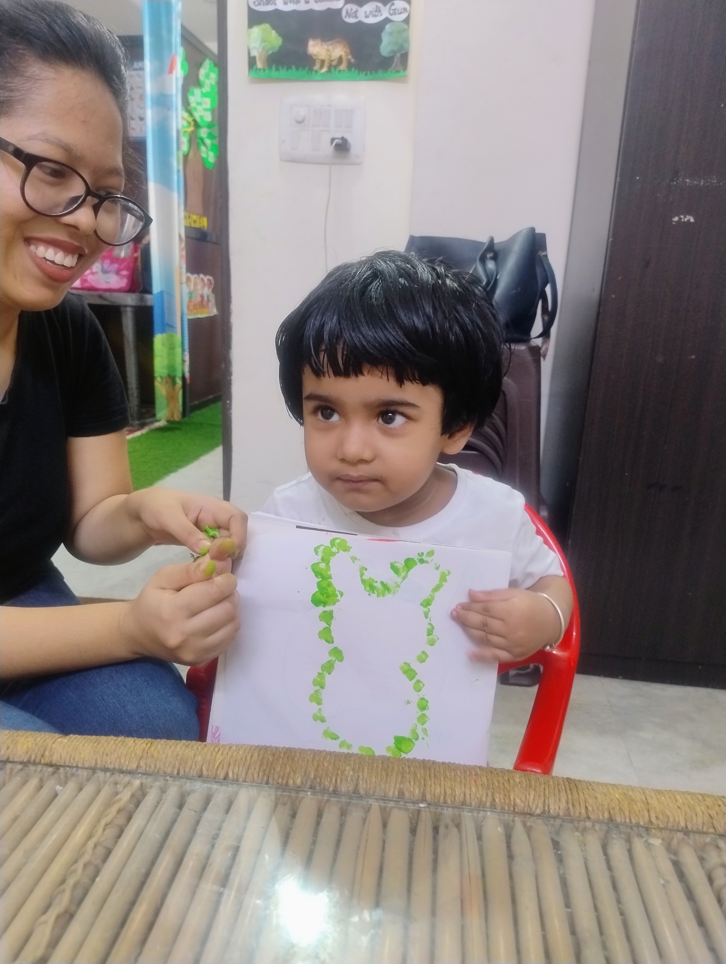Three children engaged in a learning activity